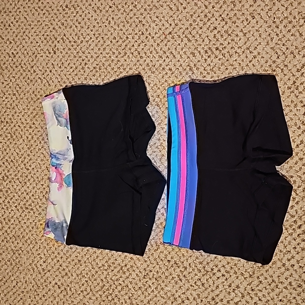 2 pairs of Ivivva booty shorts reversible all black on the inside. Girls size 8